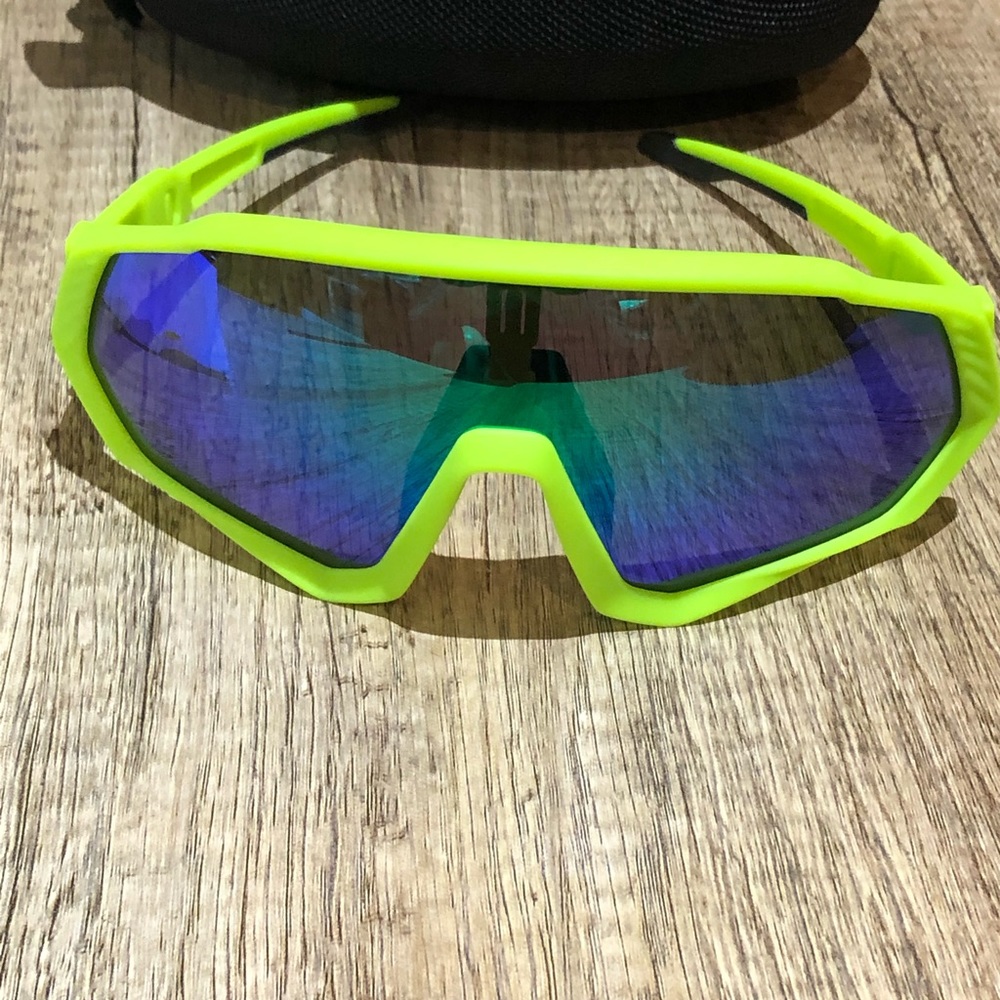 Neon yellow sunglasses with interchangeable lenses